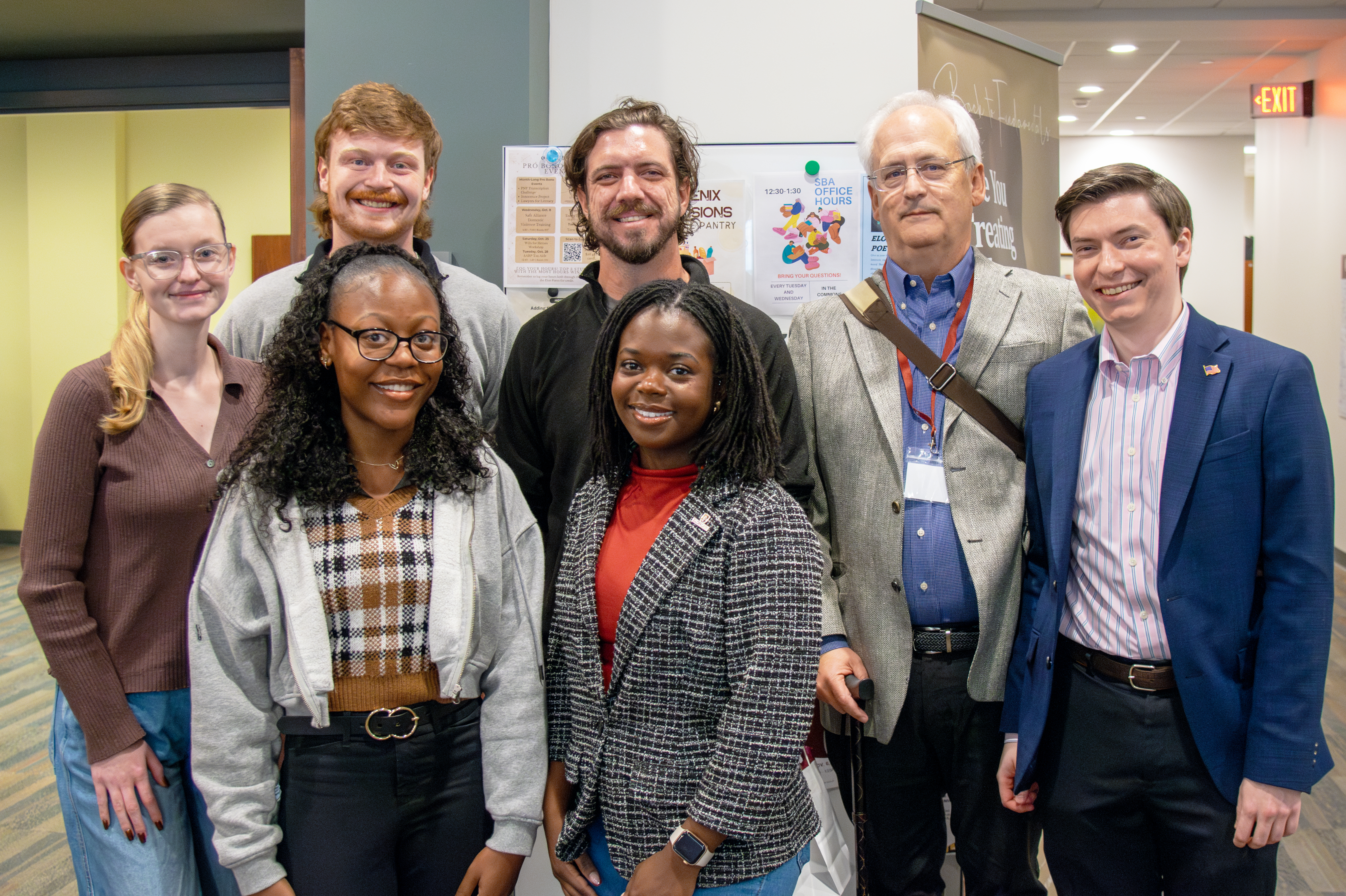 Seven students posed in Cemala Commons.