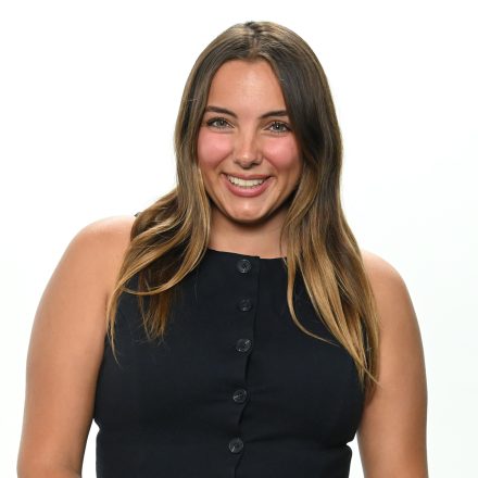 Elon's Anjolina Fantaroni stands before a white wall.