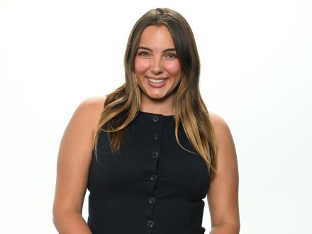 Elon's Anjolina Fantaroni stands before a white wall.