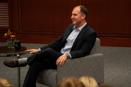 Photo of Clayton Collins '07 at Elon University speaking as the C. Ashton Newhall Speaker