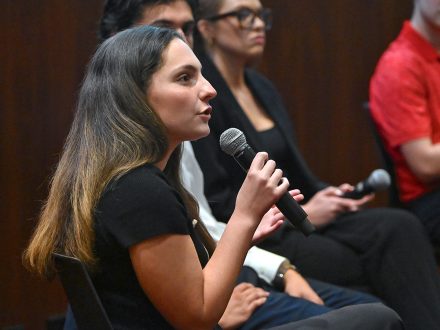 Elon's Sasha Barnett speaks with microphone
