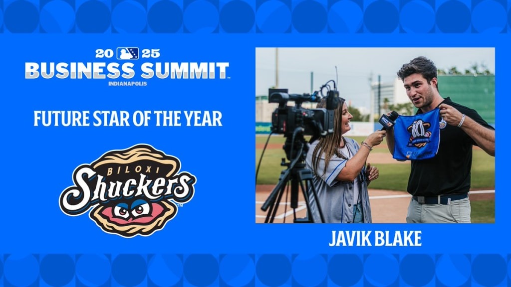 Javik Blake '23 stands with Biloxi Shuckers towel.