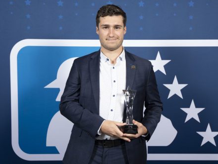 Javik Blake stands with MiLB award.