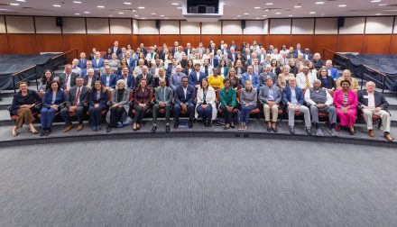 A photo of dozens of trustees and senior leaders of Elon University and Queens University of Charlotte