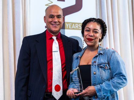 Dean Kenn Gaither stands with Asha Michelle Wilson ’13