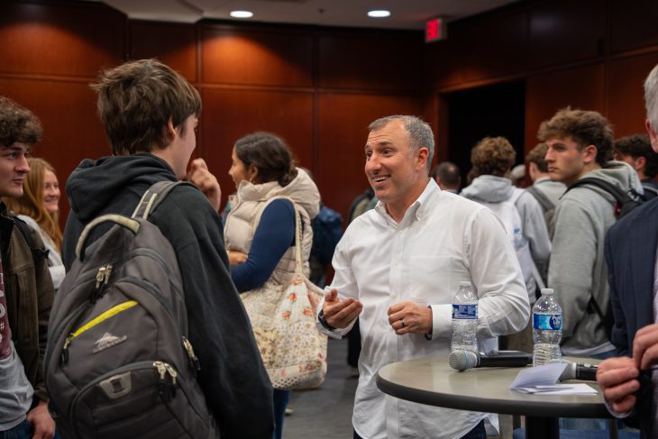 Nathan Schultz '00 talking with students after Lessons from Leaders event