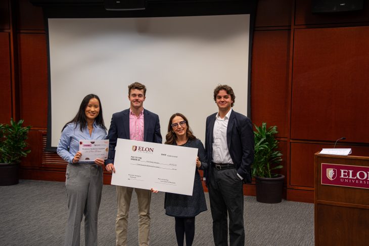 Maylee Clerici ’26, Andrew Glas ’26 and Mike McLain ’26 with Grace Chadwick, Chief Operating Officer at Crumbl