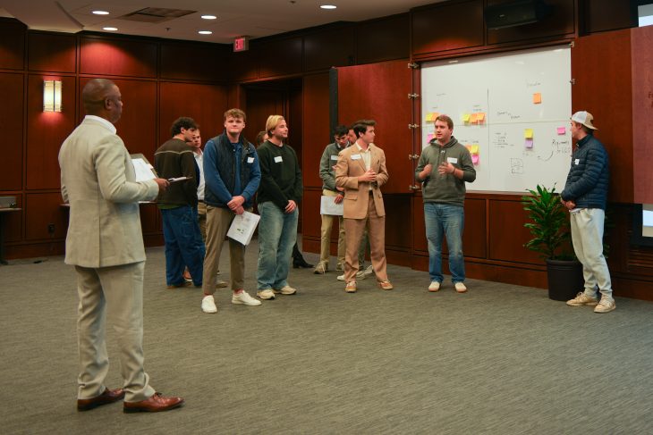 Students in the Innovation Team presenting to Sean Suggs