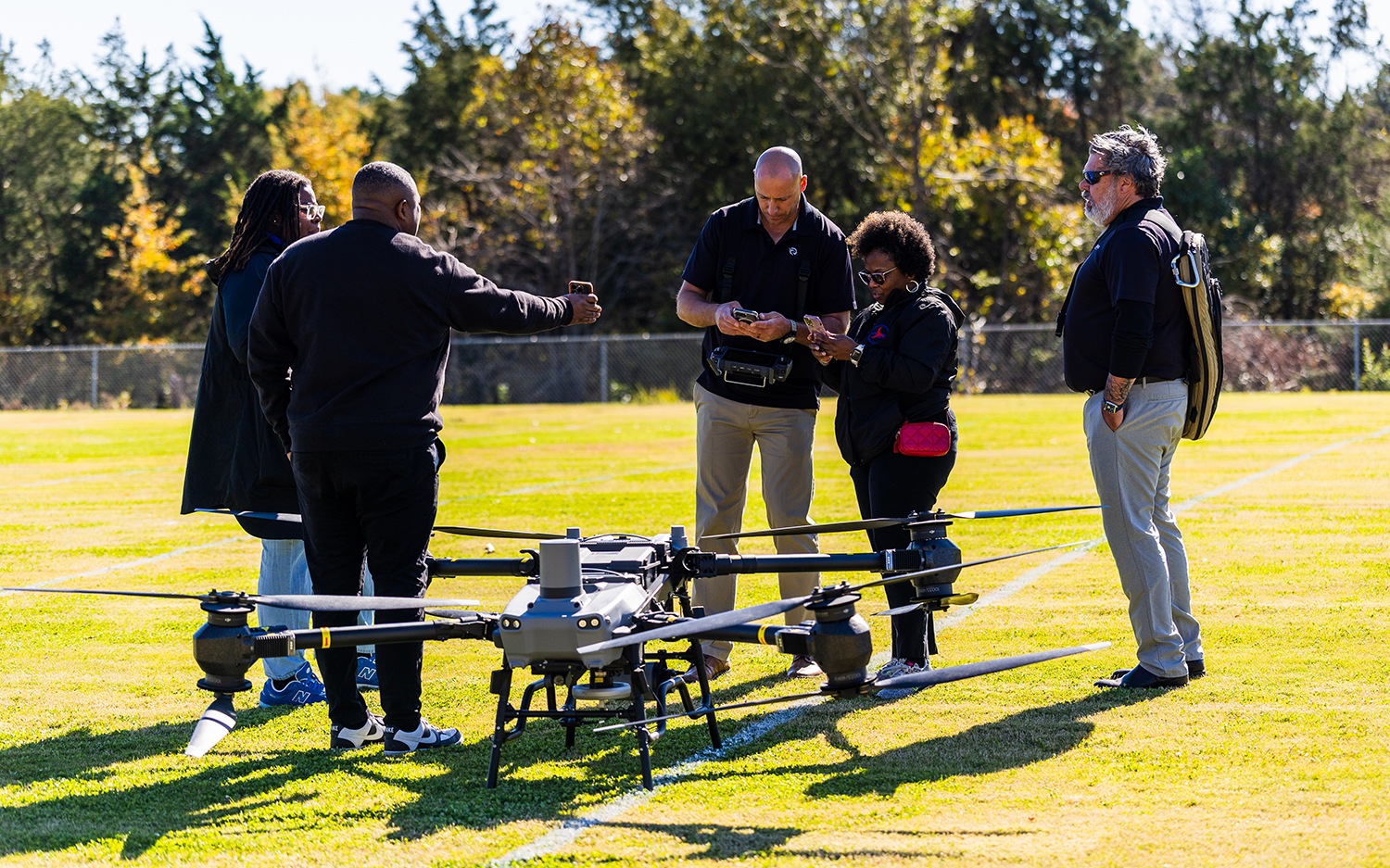 Nick Bogert of Raven Advisory talks with a drone in the foreground.