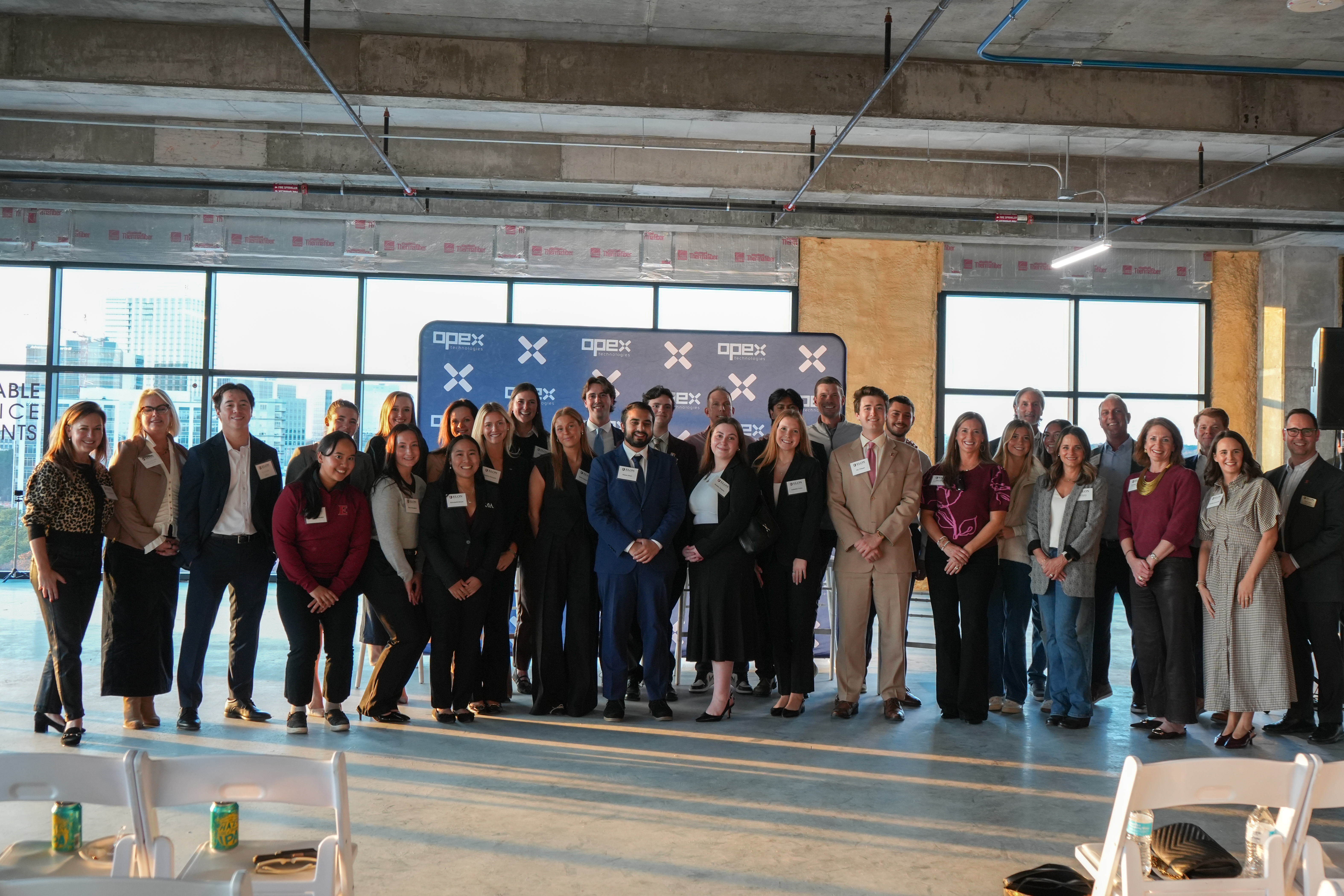 Elon University current students and alumni at the Opex Technology event on Nov. 19