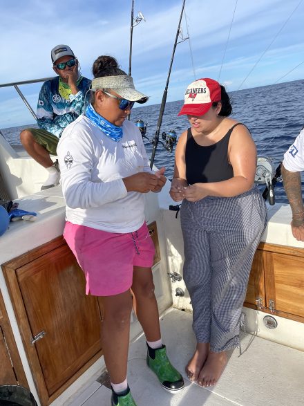 Molina learns how to tie fishing knots