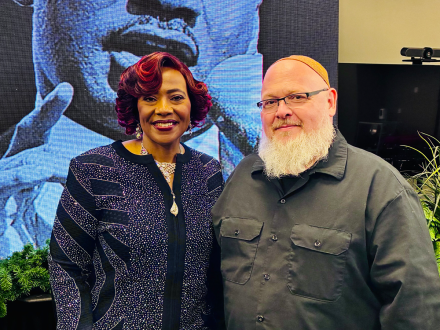 Rev. Bernice King and Imam Shane Atkinson pose together and smile during an event honoring the legacy of Dr. Martin Luther King Jr.