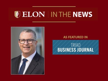 Red “Elon in the News” graphic with a headshot of a smiling man wearing glasses, a dark suit, and blue tie, alongside the text “As featured in Triad Business Journal” and the publication’s logo.