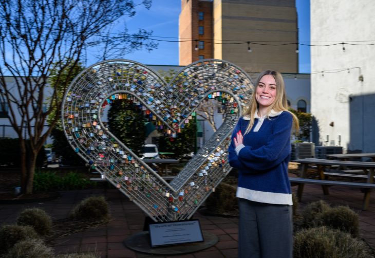 Elon Year of Service Fellow Juliana Butler at the “Heart of Downtown” sculpture in Burlington, N.C. on January 21, 2026