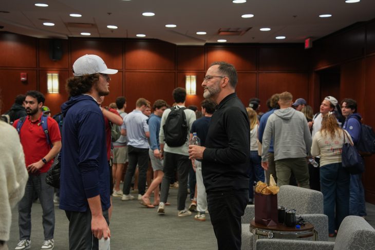 Students talking with speaker at Lessons from Leaders event with Tom O'Leary on Feb. 19 in the LaRose Digital Theatre