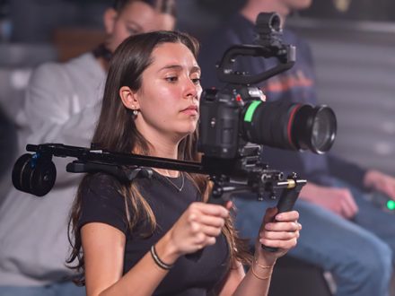 Elon student Molly Clayton with a camera