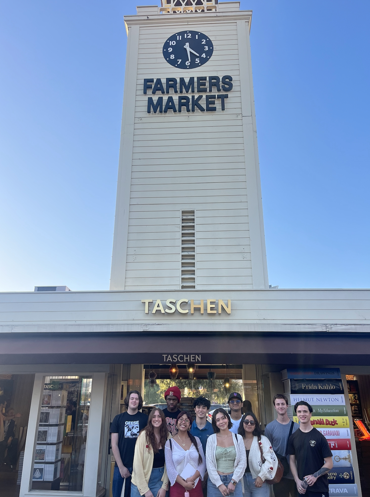 A group of Elon University students pose for a photo in front of the LA Farmer's Market