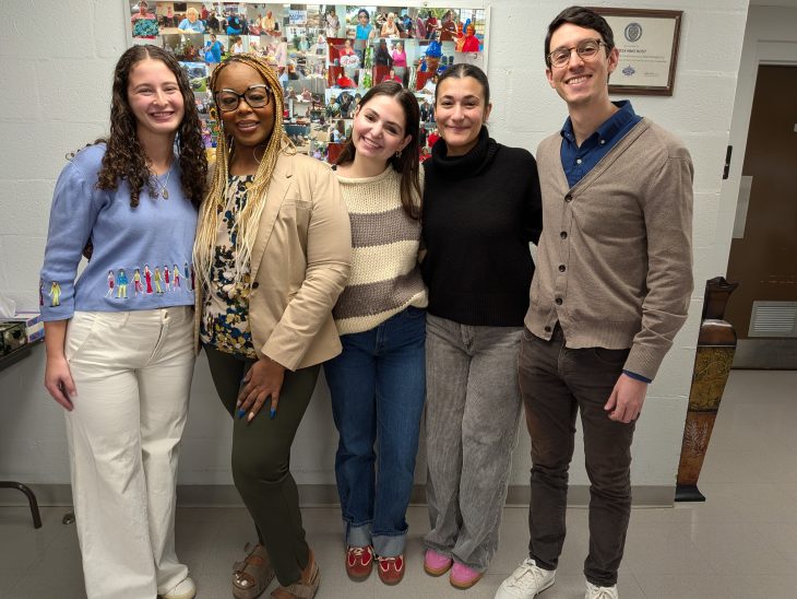 Students stand with Burlington Homes staff