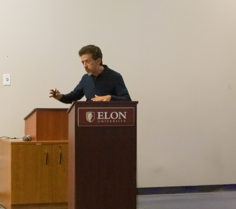 Man stands at podium delivering a speech.