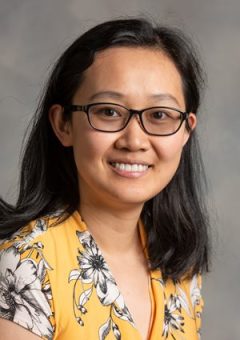 Headshot of Yidi Wu, she has dark hair and is wearing a yellow blouse