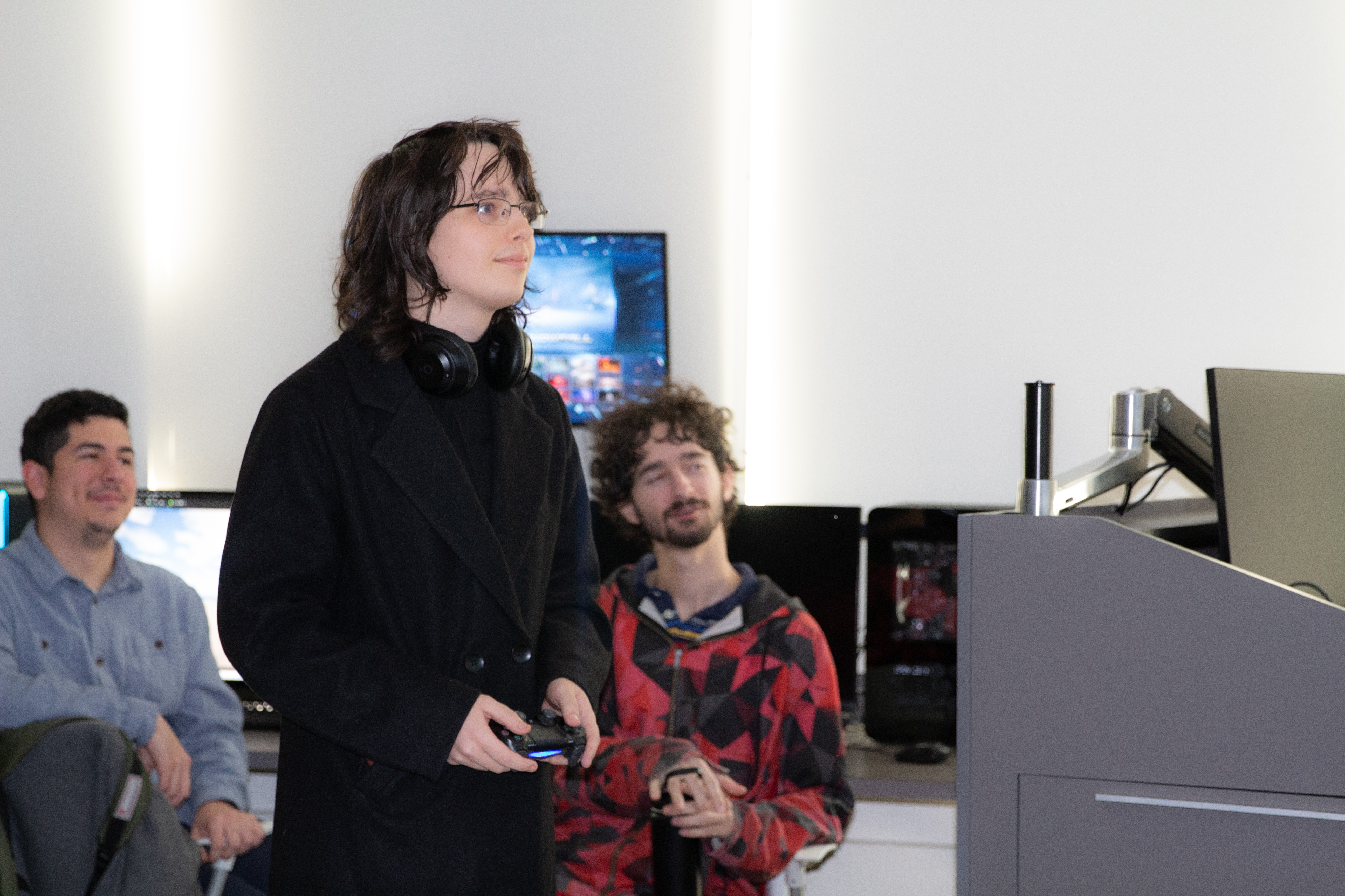 Male student holding a video game controller