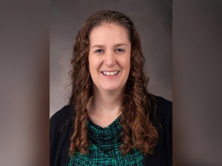 Women with brown hair smiling