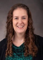 Women with brown hair smiling