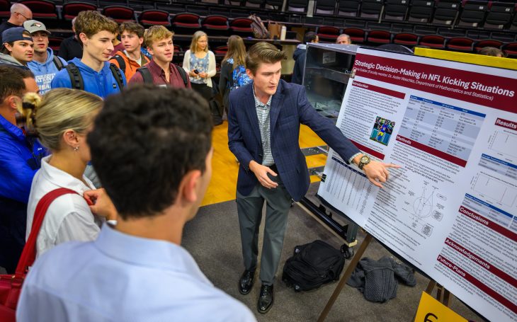 Chris Guider '29 presents his research during the Spring Undergraduate Research Forum in Alumni Gym on April 28, 2026.
