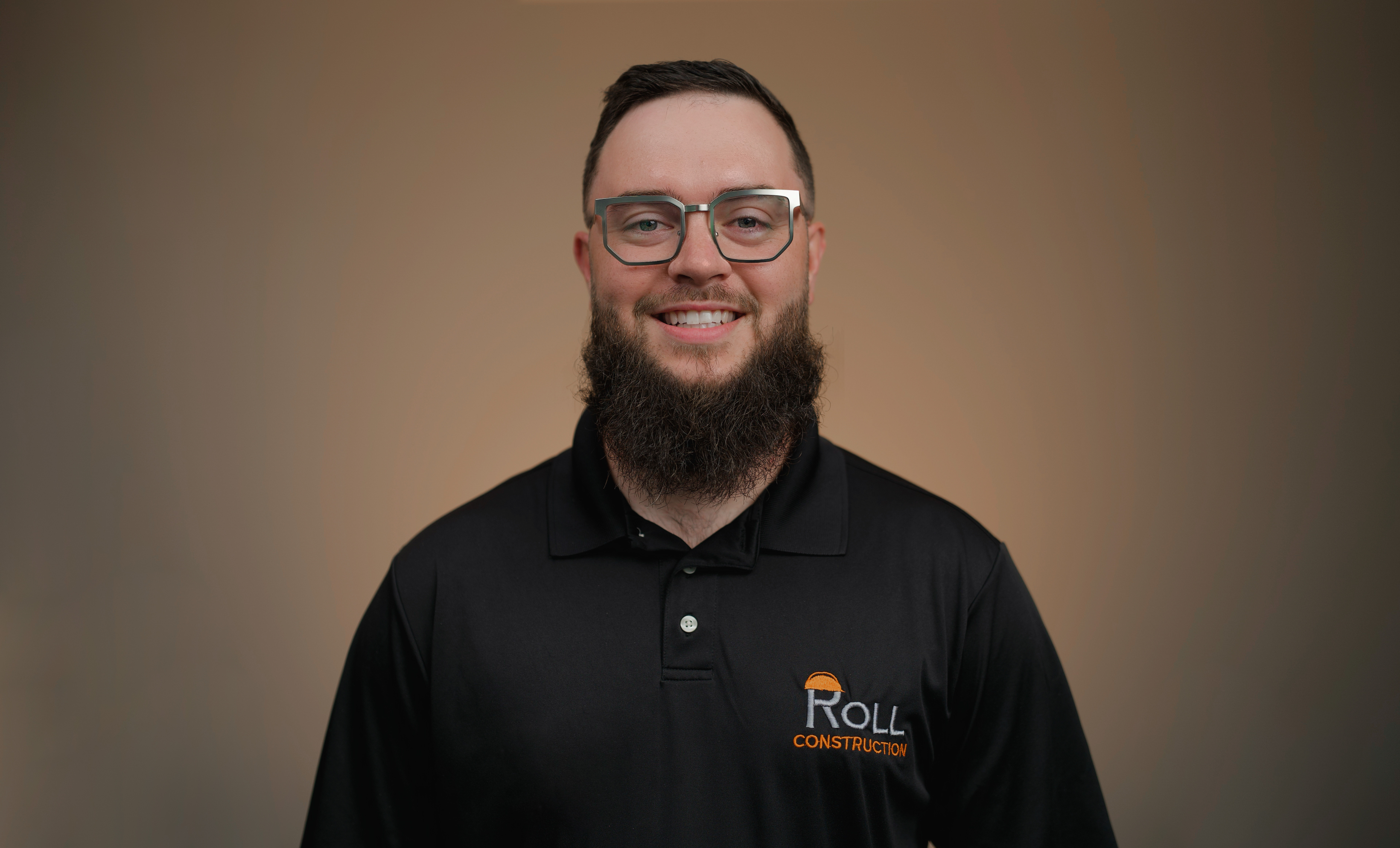 Jensen Roll '16, smiles for a Roll Construction photo.