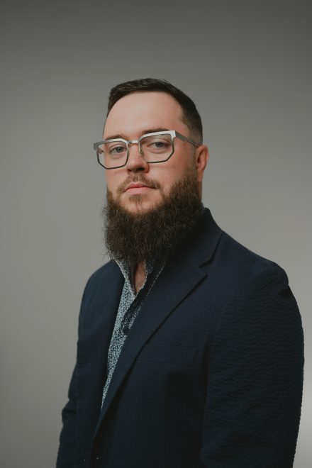 Jensen Roll '16 poses for a headshot photo.