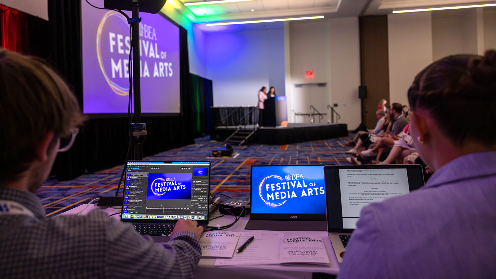 ���ϲ����� students Philip Doherty (left) and Kira Hancuff in Las Vegas with BEA awards show.