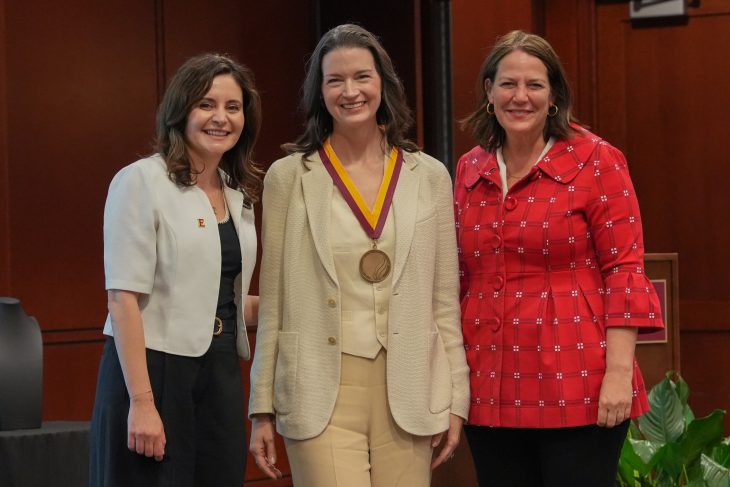 Dean Haya Ajjan, Linda Findley '95, and Elon University President Connie Ledoux Book after presenting the medal