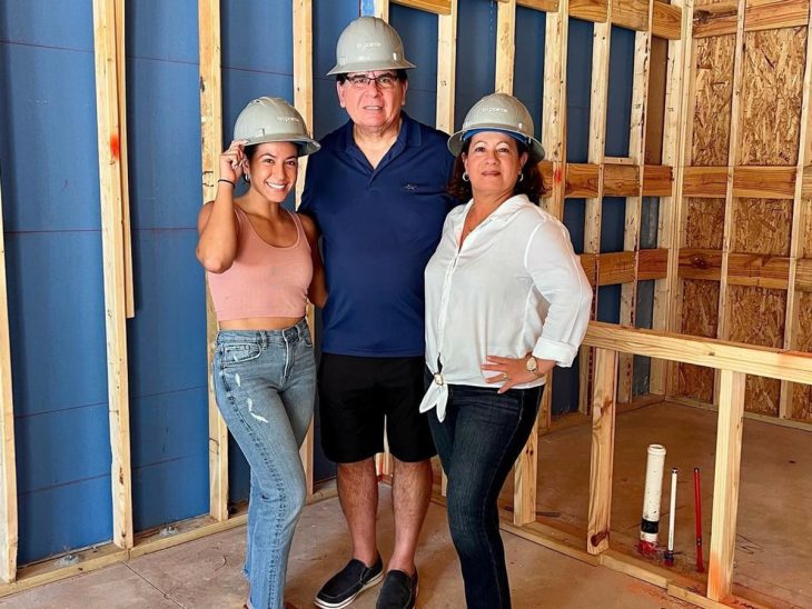 Daniela Pereyra ’16 building one of her investment properties with her parents.