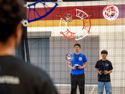 Students compete in drone soccer in an ������Ƶ gym.