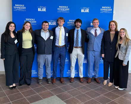 Associate Professor Chris Nelson and Executive in Residence Ann Fritchman with the team at the competition