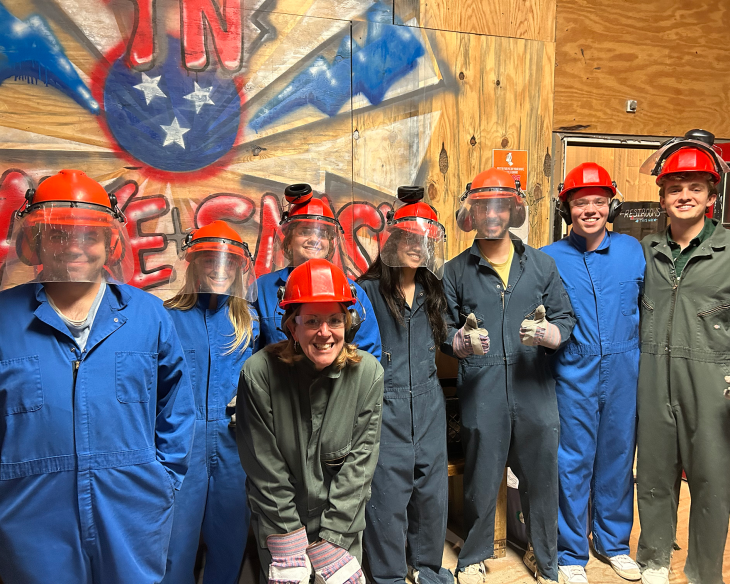 The team enjoying some post-competition fun at a rage room and axe throwing venue