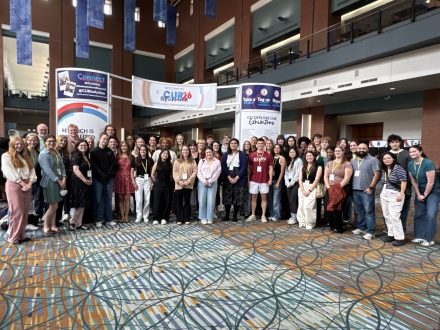 A large group of ������Ƶ students pose for a photo in a convention center