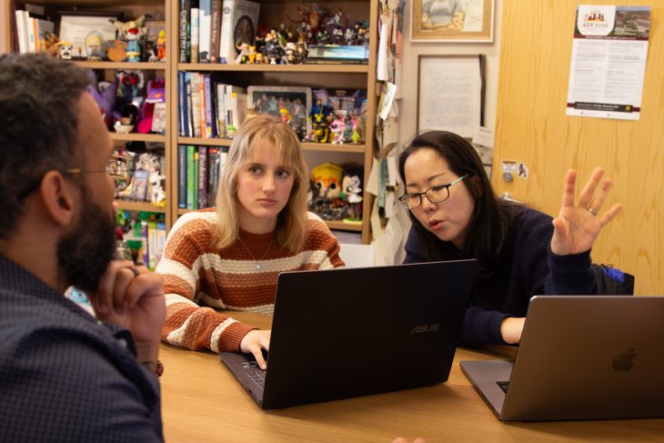 Elise, Hwayeon and Efrain collaborating on research