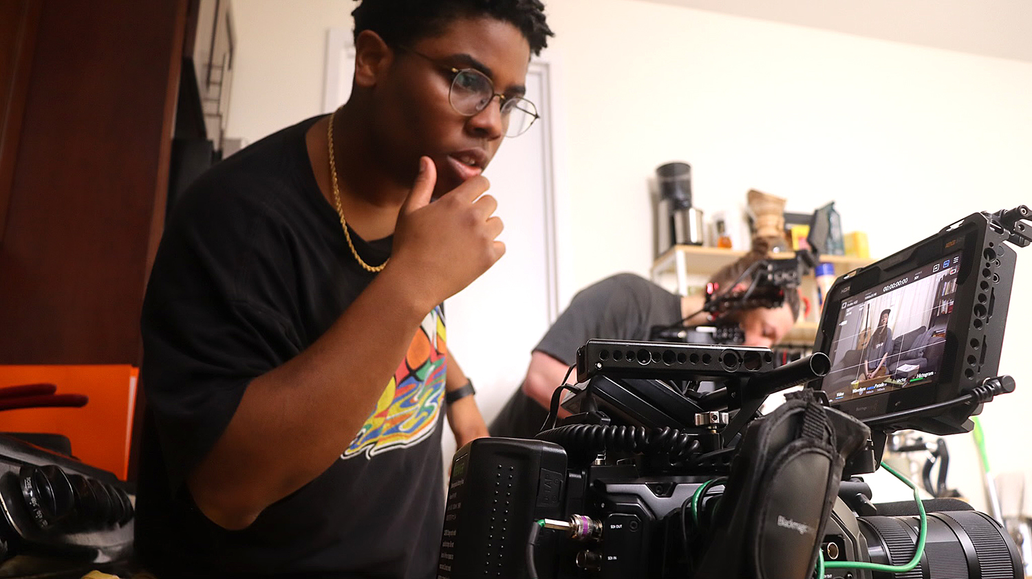 Lumiere Rostick ’20 works with a camera