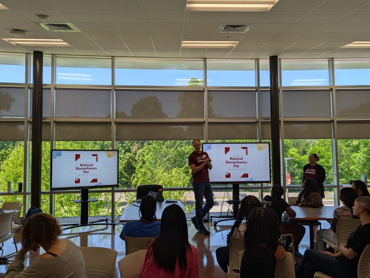 Students sit together in the Career and Technical Education Center (CTEC) , listening as the day’s activities are introduced before breaking into smaller groups