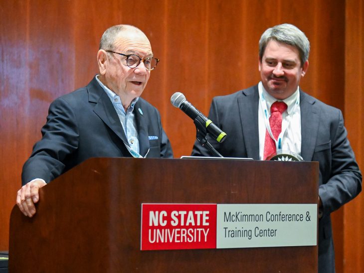 Hugh Stevens accepts an award at the Summit