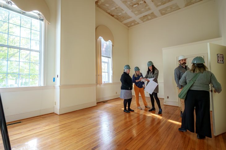 Administrators and staff involved with the launch of the Roberts Academy at Elon University toured a Trollinger House under renovation in preparation for the arrival of third- and fourth-grade students in August.