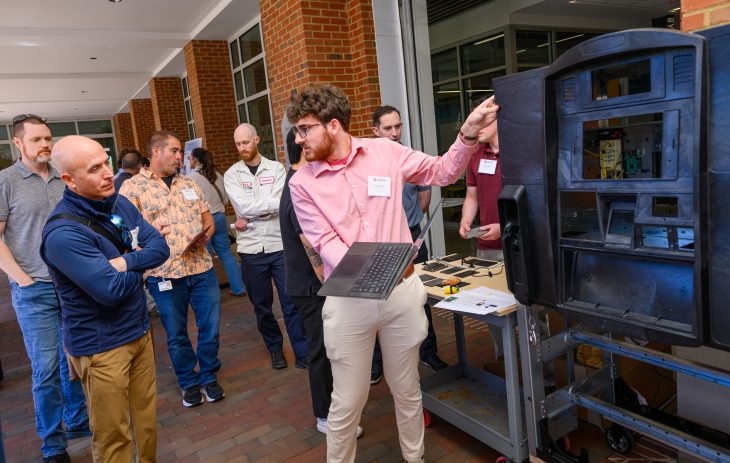 Jacob Karty ’26 showcases his team's work during SPEED demonstrations at Founders Hall on May 8, 2026. (Photo by Grant Halverson/Elon University)