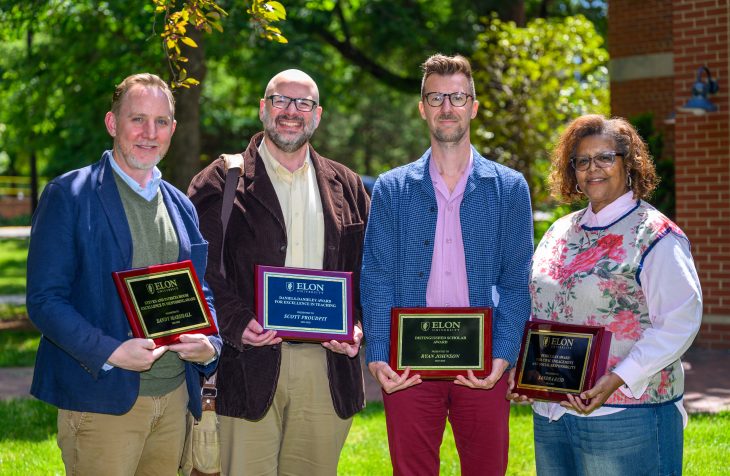 Award winners (L-R) Sandy Marshall, Scott Proudfit, Ryan Johnson and Sandra Reid pose with their plaques during the 2026 Faculty-Staff Awards at Alumni Gym on May 12, 2026. (Photo by Grant Halverson/Elon University)