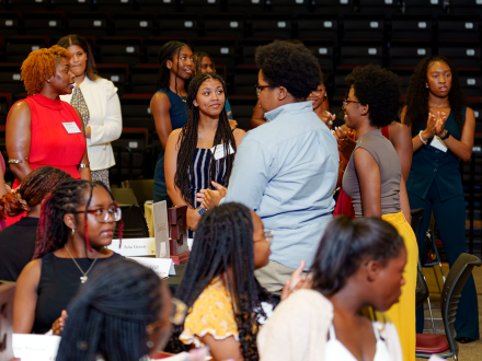 Attendees connect and celebrate together during the 2026 Phillips-Perry Black Excellence Awards, engaging in conversation and recognition of student achievement and leadership.