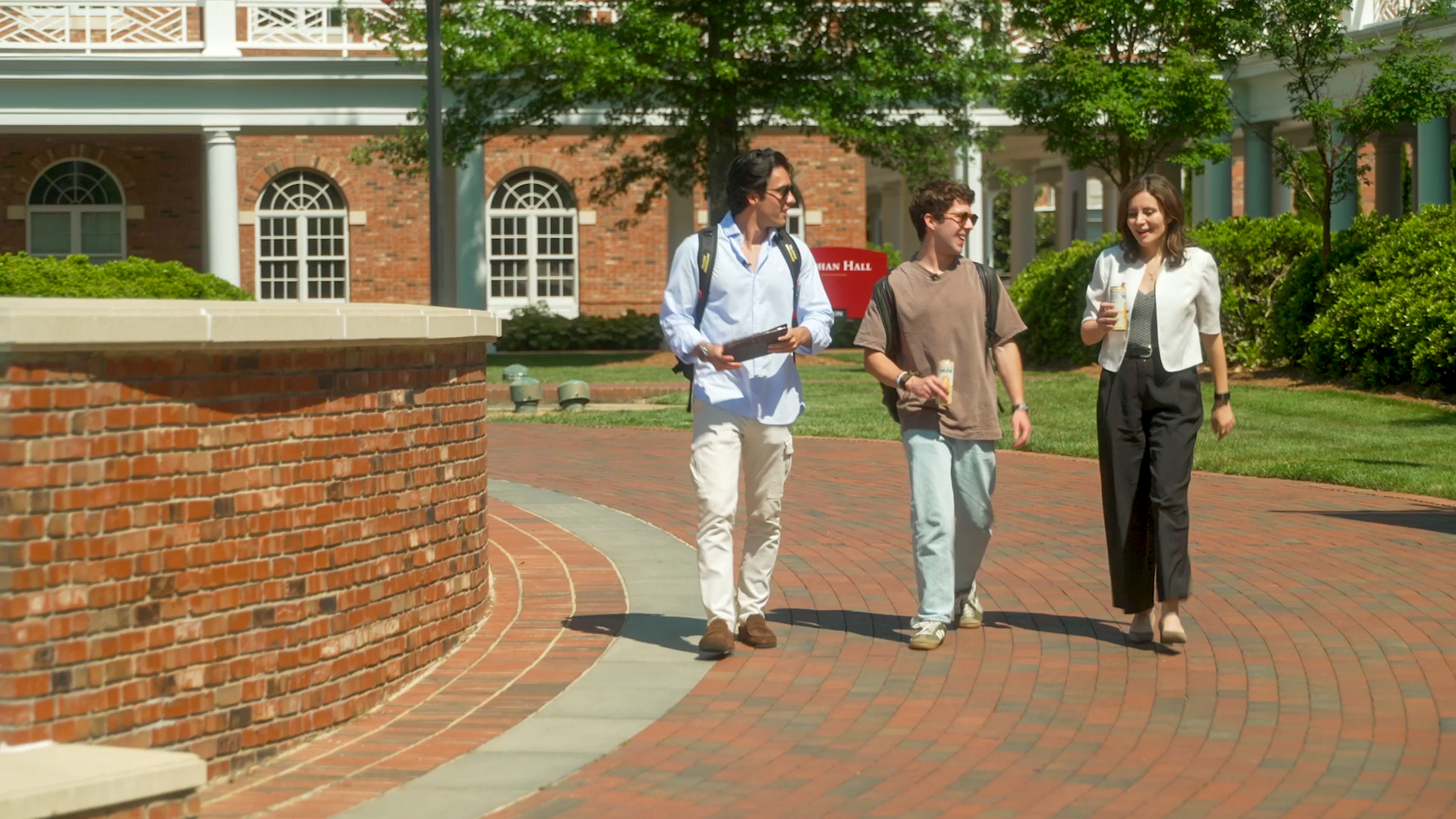 Vargas-Lopez and Chiriboga with Dean Haya Ajjan of the Martha and Spencer Love School of Business