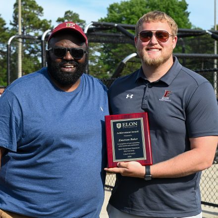 Elon professor Khirey Walker with Emerson Baker