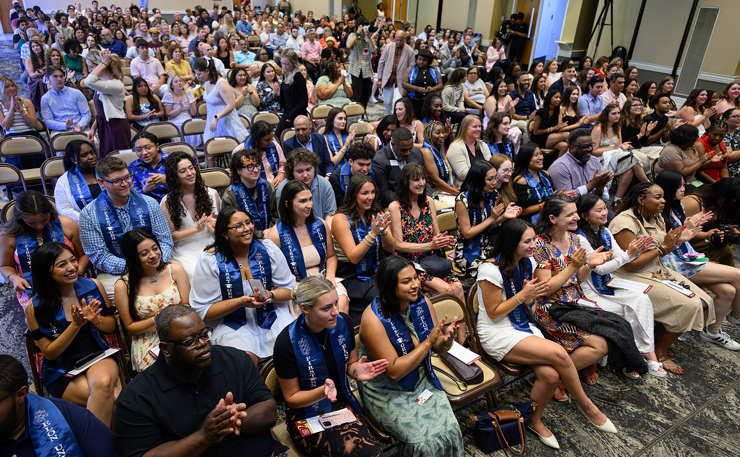 Students and families pack McKinnon Hall
