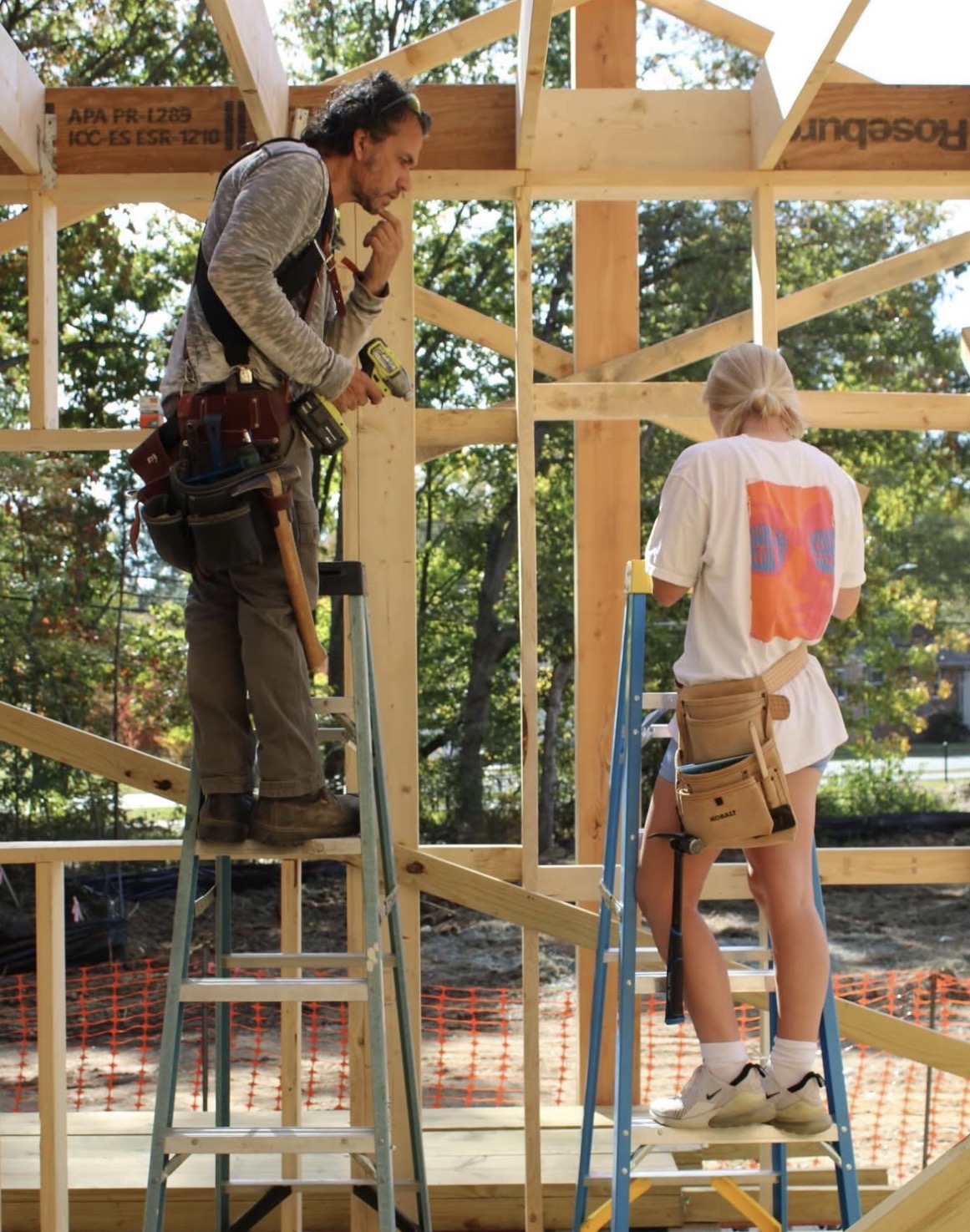 MaryKate Hart ’26 and Robert Charest building house 1 at Loy Farm. 
