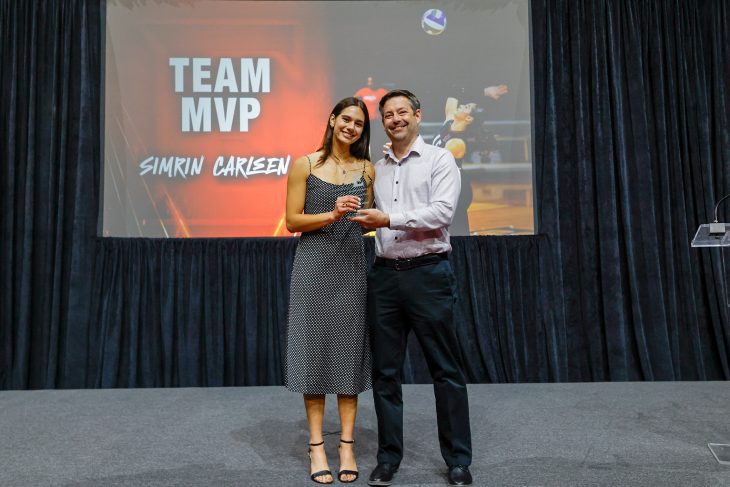 Simrin Carlsen G’26 receives the Team MVP award from Coach Matt Troy during the 2026 Phoenix Athletic Awards at Schar Center